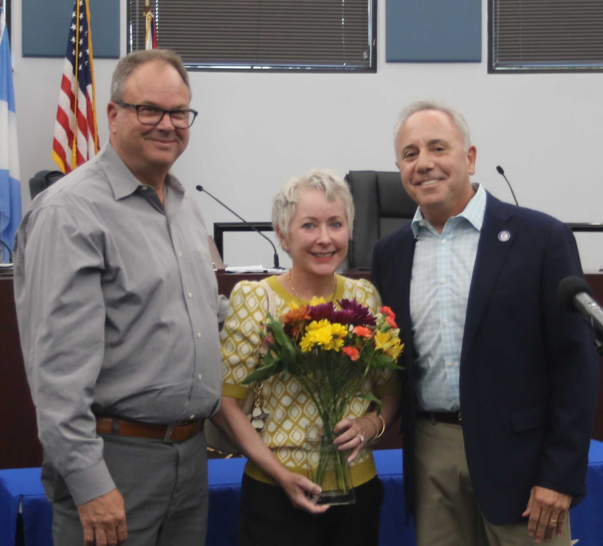 Mr. and Mrs. Nagel with flowers and Mayor Sirkin